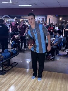 A bowler on the Unified team lines up a roll