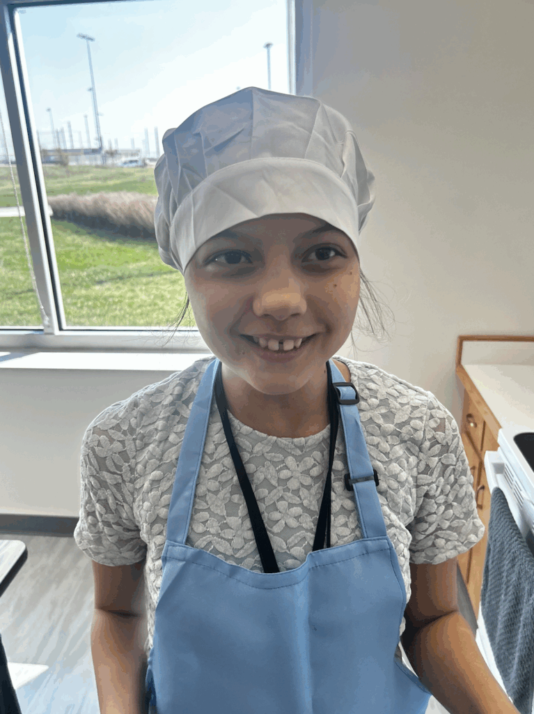 Unified Culinary student wearing an apron