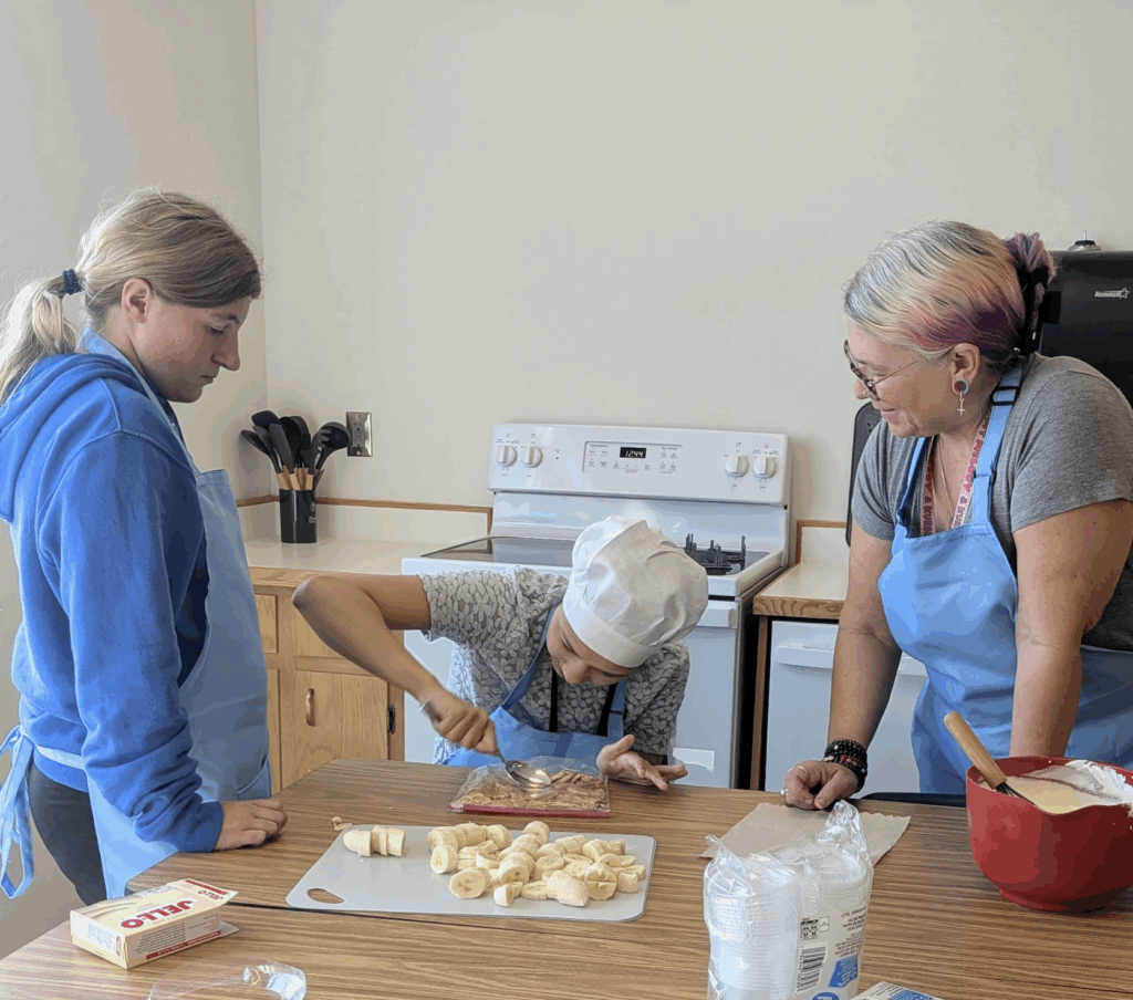 Unified Culinary students preparing bread with a teacher